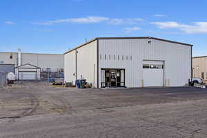 View of outdoor structure with a garage