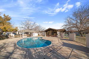 View of pool featuring a pergola and a patio area