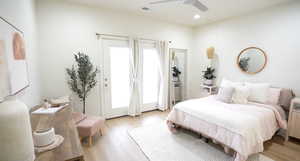 Bedroom featuring ceiling fan and light hardwood / wood-style floors