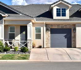 View of front of property featuring a garage