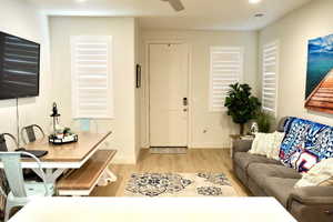 Living room with light hardwood / wood-style floors