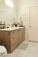 Bathroom with vanity and toilet