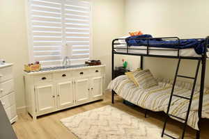 Bedroom with light wood-type flooring