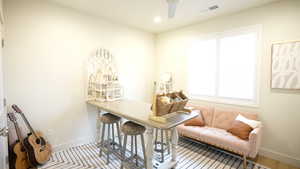 Office space featuring ceiling fan and light wood-type flooring