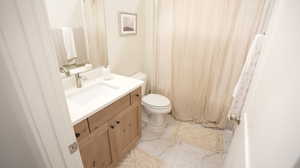 Bathroom with vanity and toilet