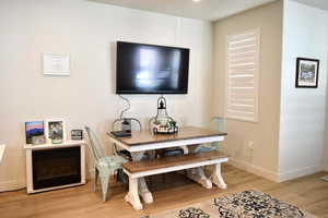 Dining area with light hardwood / wood-style floors