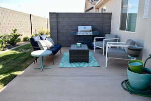 View of patio / terrace featuring an outdoor living space and grilling area