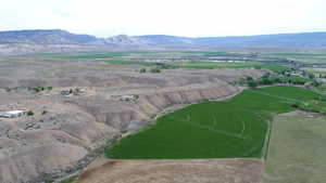 Drone / aerial view with a mountain view and a rural view