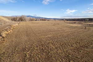 Birds eye view of property featuring a mountain view and a rural view