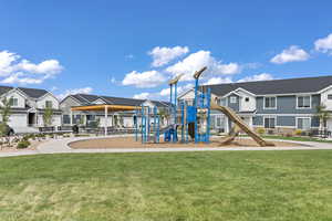 View of playground featuring a lawn