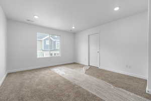 View of carpeted primary bedroom