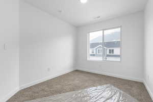 Empty room with carpet flooring