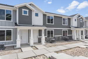 View of front of property featuring central AC