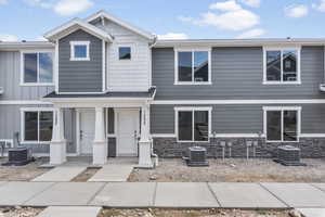 View of front of property featuring cooling unit