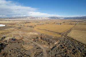 Birds eye view of property featuring a mountain view and a rural view