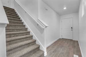 Foyer entrance featuring wood-type flooring