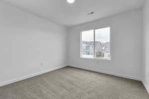 Unfurnished room featuring carpet floors