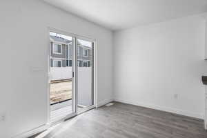 Unfurnished room with light wood-type flooring