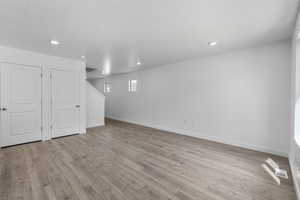 Basement featuring light hardwood / wood-style flooring