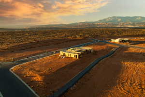 Aerial view at dusk featuring a mountain view