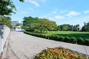 Exterior space featuring a mountain view and a yard