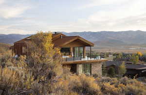 Back of house featuring a mountain view