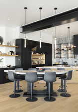 Bar with pendant lighting, light wood-type flooring, and tasteful backsplash