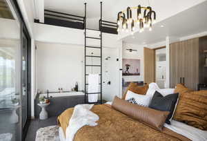 Bedroom with a notable chandelier