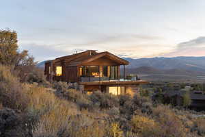 Back house at dusk with a mountain view