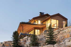 View of home's exterior with a balcony