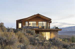 Rear view of house featuring a mountain view