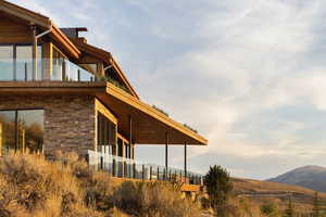 View of side of home featuring a mountain view