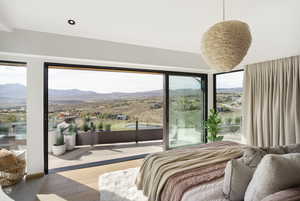 Bedroom featuring a mountain view and hardwood / wood-style flooring