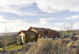 View of front of house featuring a mountain view