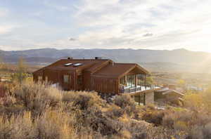 Back of house with a mountain view