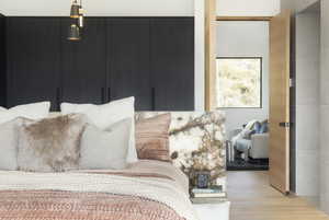 Bedroom featuring a closet and light hardwood / wood-style flooring