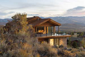 Back of property featuring a mountain view