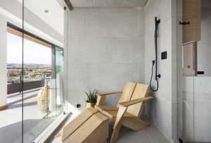 Interior space featuring a mountain view and tile walls