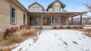 View of front of property featuring a covered porch