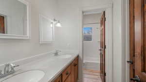 Full bathroom featuring shower / bath combination, vanity, toilet - between bedrooms 2 and 3.