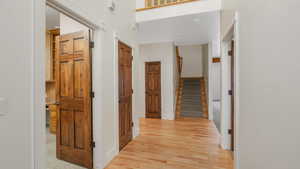 Hallway featuring maple hardwood flooring