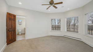 Master Bedroom with light carpet and ceiling fan