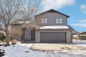 View of property with a garage