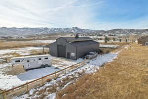 Exterior space featuring a mountain view, a garage, and an outdoor structure