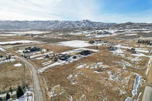 Snowy aerial view featuring a mountain view