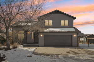 View of front of property with a garage