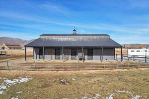 View of front facade with a mountain view and an outdoor structure