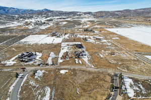 Snowy aerial view with a mountain view