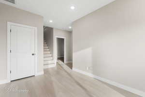 Empty room featuring light hardwood / wood-style flooring