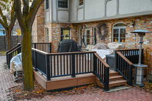 Wooden terrace featuring grilling area